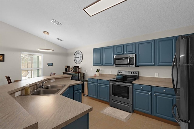 224 Highgate Park Blvd, Davenport, FL 33897 - kitchen featuring stainless steel appliances, blue cabinets, lofted ceiling, decorative light fixtures, and a textured ceiling