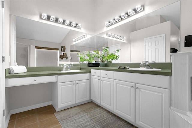 224 Highgate Park Blvd, Davenport, FL 33897 - bathroom featuring double vanity, tile patterned floors, and a shower