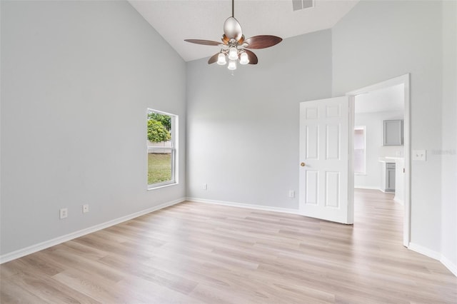 313 Cheshire Way, Davenport, FL 33897 - unfurnished room with high vaulted ceiling, ceiling fan, and light wood-type flooring