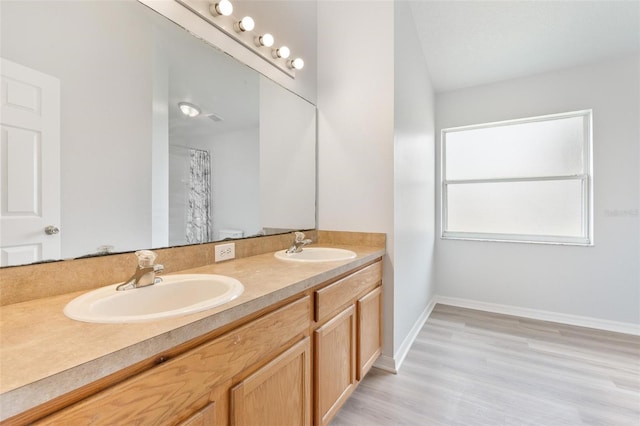 313 Cheshire Way, Davenport, FL 33897 - full bathroom featuring double vanity and wood finished floors