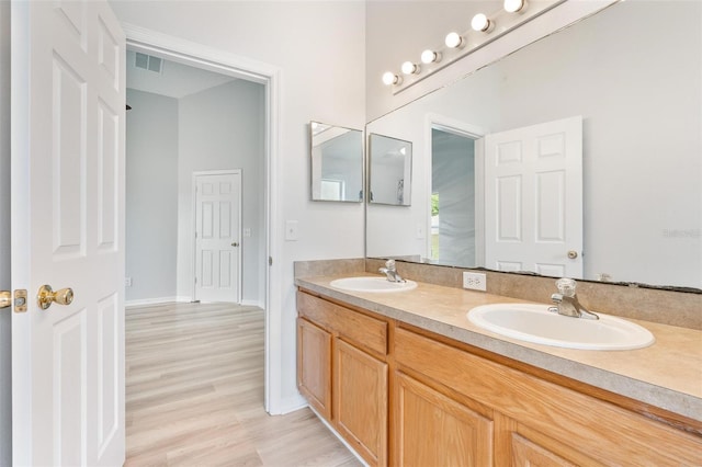 313 Cheshire Way, Davenport, FL 33897 - full bath with double vanity and wood finished floors