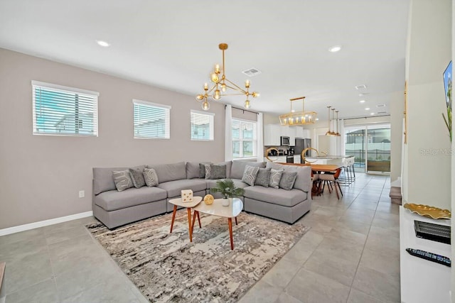 3448 Lilac Way, Davenport, FL 33897 - living area featuring a chandelier, recessed lighting, and light tile patterned floors