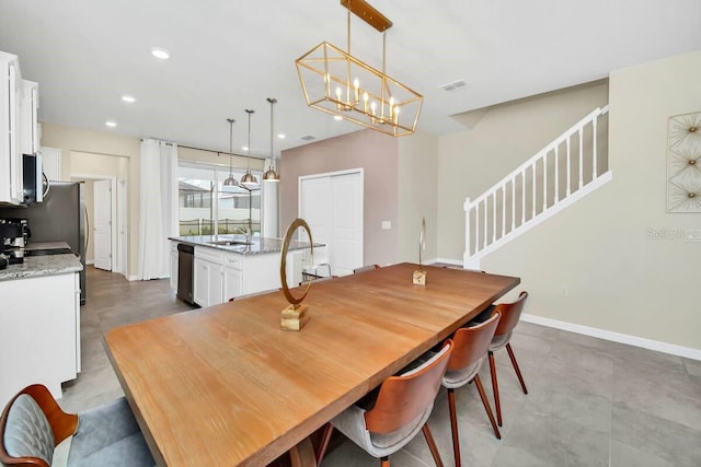 3448 Lilac Way, Davenport, FL 33897 - dining area with stairs, recessed lighting, and a chandelier