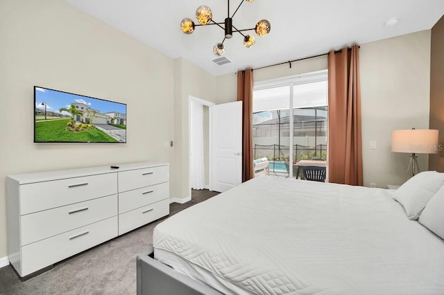 3448 Lilac Way, Davenport, FL 33897 - bedroom with access to exterior, carpet flooring, and a chandelier