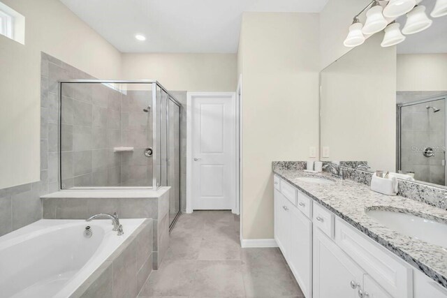 3448 Lilac Way, Davenport, FL 33897 - full bathroom with a shower stall, double vanity, a bath, and tile patterned flooring