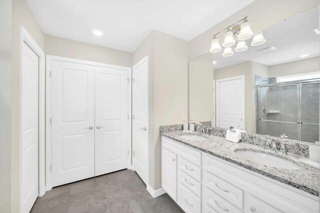 3448 Lilac Way, Davenport, FL 33897 - bathroom featuring double vanity and a shower stall