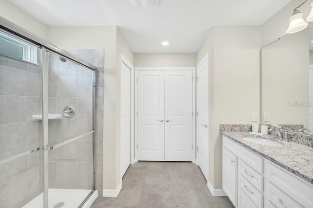 3448 Lilac Way, Davenport, FL 33897 - bathroom featuring a shower stall, vanity, and recessed lighting