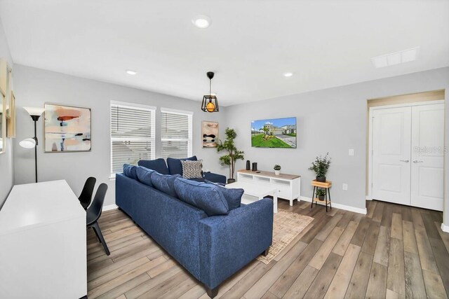 3448 Lilac Way, Davenport, FL 33897 - living area with wood finished floors and recessed lighting