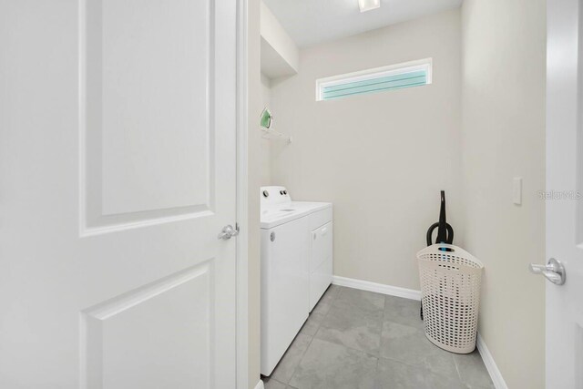 3448 Lilac Way, Davenport, FL 33897 - washroom featuring washer and clothes dryer and baseboards