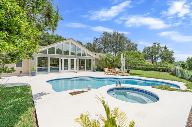 7905 Chad Ct, Orlando, FL 32835 - swimming pool with an in-ground hot tub, french doors, and a patio
