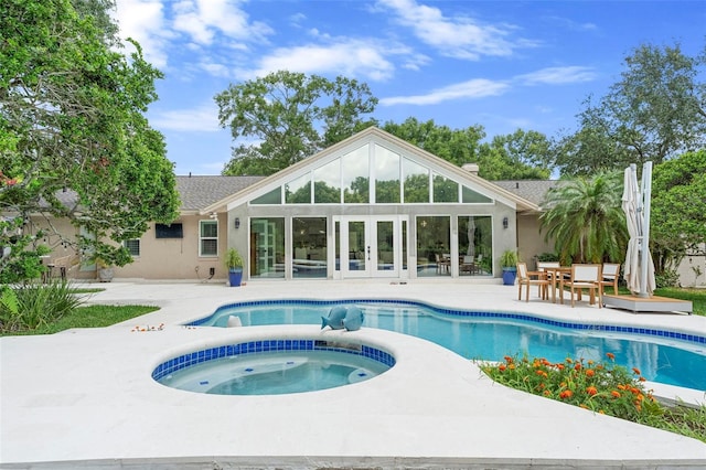 7905 Chad Ct, Orlando, FL 32835 - view of swimming pool with french doors, a patio, and a pool with connected hot tub