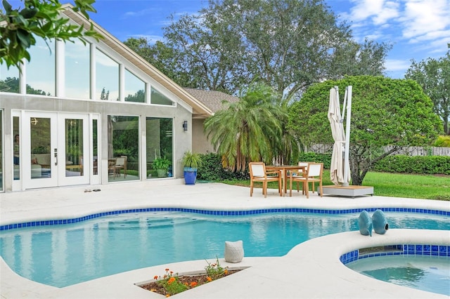 7905 Chad Ct, Orlando, FL 32835 - swimming pool featuring a patio, french doors, and an in-ground hot tub