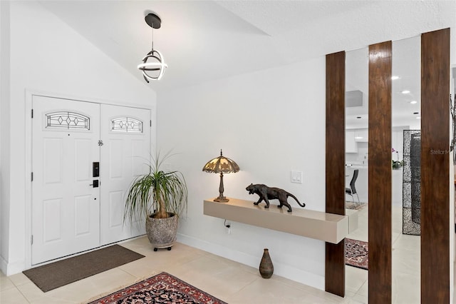 7905 Chad Ct, Orlando, FL 32835 - foyer entrance featuring light tile patterned floors and lofted ceiling