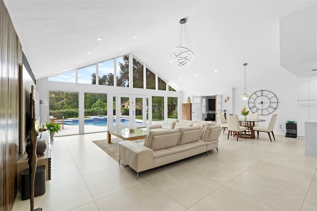 7905 Chad Ct, Orlando, FL 32835 - living room with high vaulted ceiling, french doors, and light tile patterned flooring