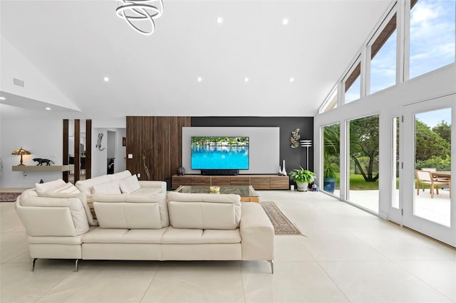 7905 Chad Ct, Orlando, FL 32835 - living area featuring high vaulted ceiling, light tile patterned flooring, and recessed lighting