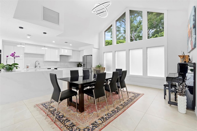 7905 Chad Ct, Orlando, FL 32835 - dining room with light tile patterned floors, plenty of natural light, and a high ceiling