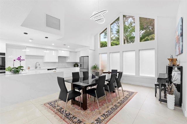 7905 Chad Ct, Orlando, FL 32835 - dining room featuring light tile patterned floors, high vaulted ceiling, and recessed lighting