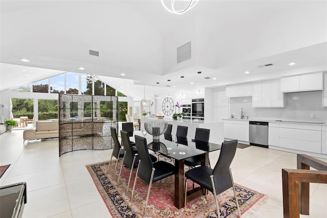 7905 Chad Ct, Orlando, FL 32835 - dining room featuring light tile patterned flooring, recessed lighting, and high vaulted ceiling