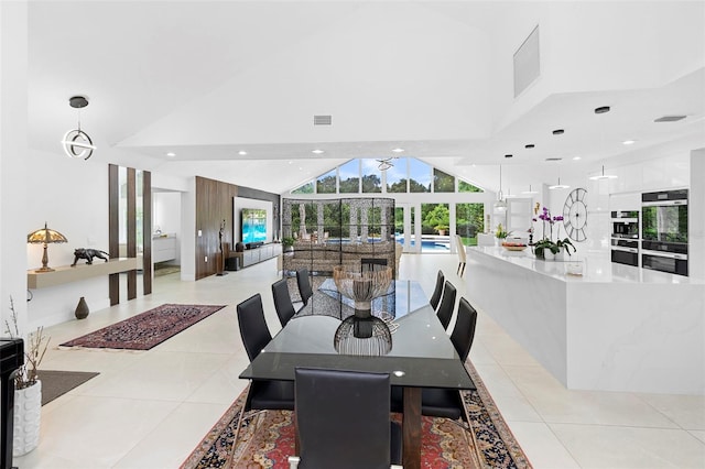 7905 Chad Ct, Orlando, FL 32835 - dining space featuring light tile patterned floors, high vaulted ceiling, french doors, and recessed lighting