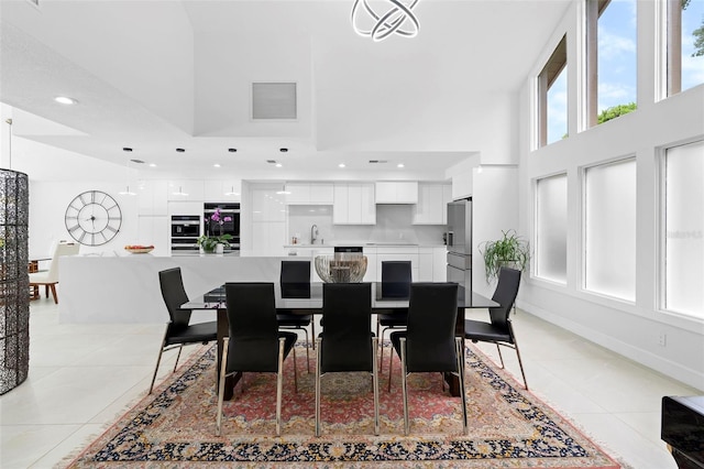 7905 Chad Ct, Orlando, FL 32835 - dining area featuring a towering ceiling, light tile patterned floors, and recessed lighting
