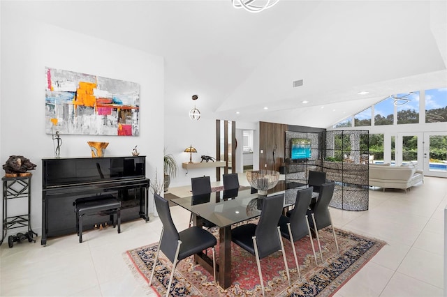 7905 Chad Ct, Orlando, FL 32835 - dining space with light tile patterned floors, high vaulted ceiling, and recessed lighting