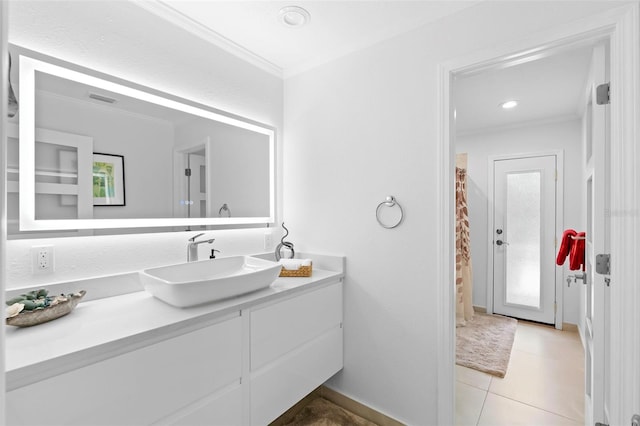 7905 Chad Ct, Orlando, FL 32835 - bathroom featuring crown molding, vanity, and tile patterned floors