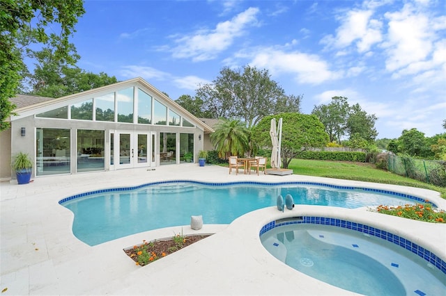 7905 Chad Ct, Orlando, FL 32835 - view of swimming pool featuring french doors, a patio, and a pool with connected hot tub