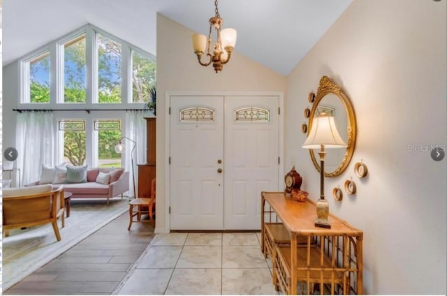 7905 Chad Ct, Orlando, FL 32835 - entryway with a chandelier, healthy amount of natural light, and high vaulted ceiling