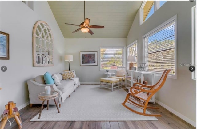 7905 Chad Ct, Orlando, FL 32835 - living area featuring a ceiling fan, wood finished floors, and high vaulted ceiling