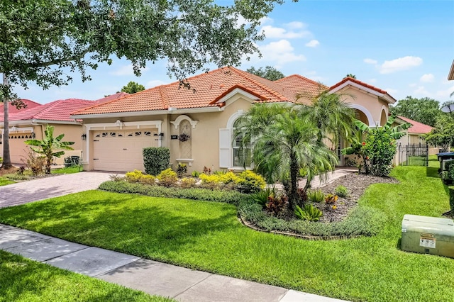 11337 Via Andiamo, Windermere, FL 34786 - mediterranean / spanish home featuring stucco siding, a tile roof, an attached garage, and driveway