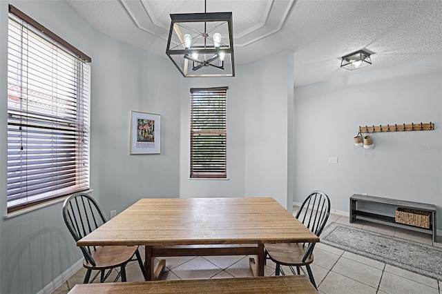 11337 Via Andiamo, Windermere, FL 34786 - dining area featuring light tile patterned floors, a chandelier, and a textured ceiling