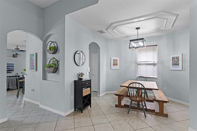 11337 Via Andiamo, Windermere, FL 34786 - dining area with arched walkways, a textured ceiling, light tile patterned flooring, and ceiling fan