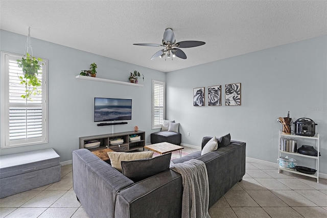 11337 Via Andiamo, Windermere, FL 34786 - living area featuring light tile patterned flooring, a ceiling fan, and a textured ceiling