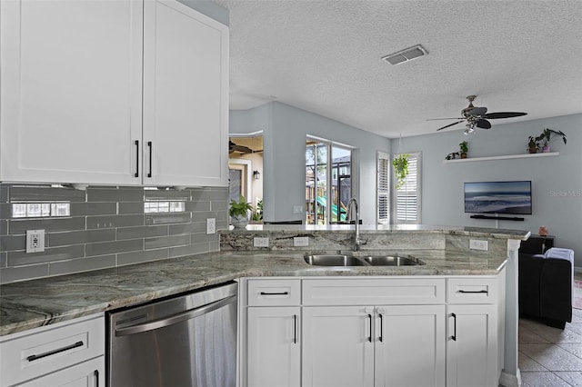 11337 Via Andiamo, Windermere, FL 34786 - kitchen with stainless steel dishwasher, a peninsula, open floor plan, white cabinetry, and ceiling fan