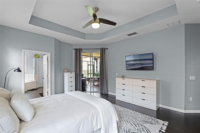 11337 Via Andiamo, Windermere, FL 34786 - bedroom with access to outside, a raised ceiling, dark wood-type flooring, connected bathroom, and ceiling fan