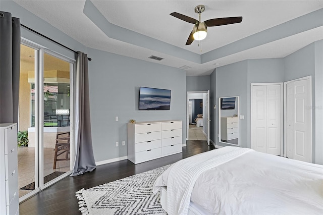 11337 Via Andiamo, Windermere, FL 34786 - bedroom with multiple windows, access to outside, dark wood-style floors, and a ceiling fan