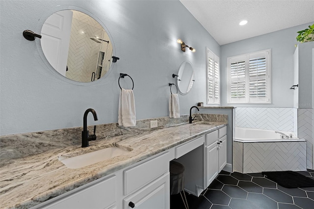 11337 Via Andiamo, Windermere, FL 34786 - full bath with a garden tub, tile patterned floors, double vanity, a textured ceiling, and recessed lighting