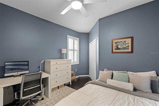 11337 Via Andiamo, Windermere, FL 34786 - bedroom with a textured ceiling, a closet, wood finished floors, ceiling fan, and an office area