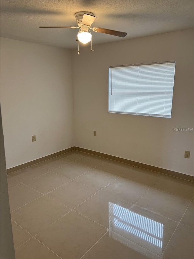767 Willie Mays Pkwy, Orlando, FL 32811 - spare room featuring tile patterned flooring and a ceiling fan
