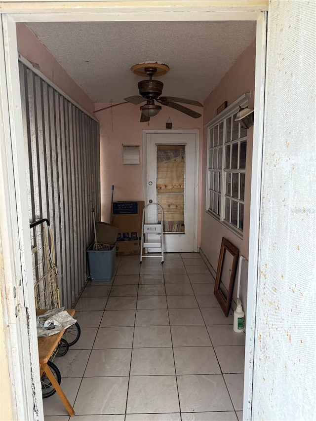 5300 Washington St Unit 340P, Hollywood, FL 33021 - hall featuring light tile patterned floors and a textured ceiling