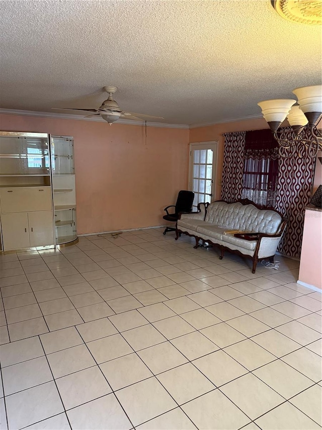 5300 Washington St Unit 340P, Hollywood, FL 33021 - living room featuring a textured ceiling, crown molding, ceiling fan, and light tile patterned floors