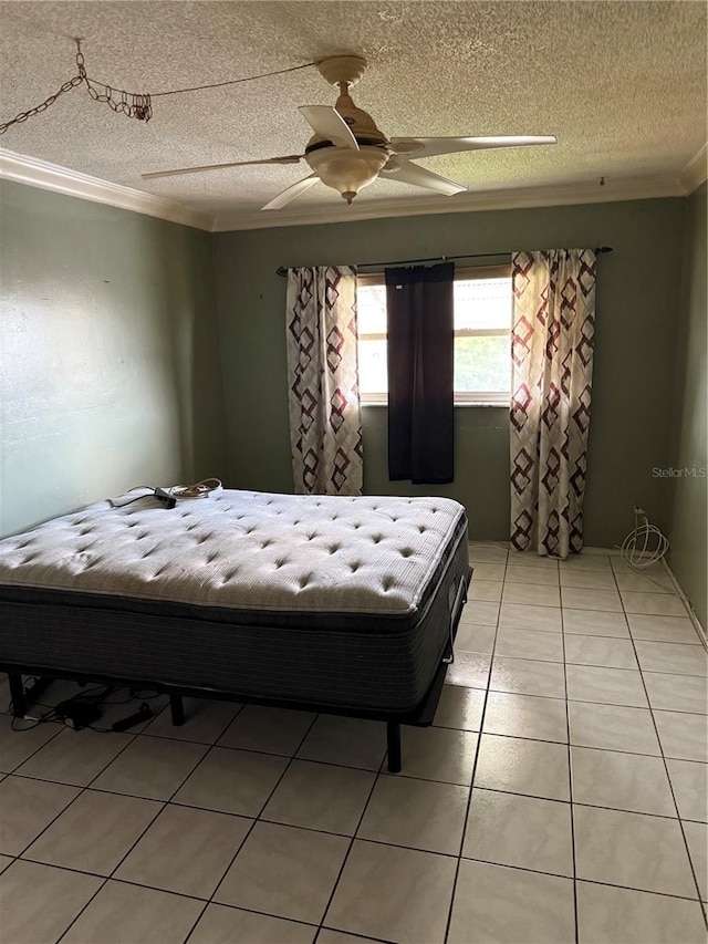 5300 Washington St Unit 340P, Hollywood, FL 33021 - bedroom featuring crown molding, a ceiling fan, light tile patterned floors, and a textured ceiling