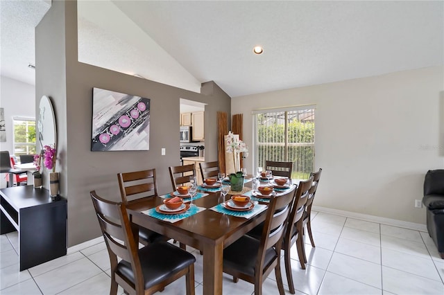 2979 Viscount Cir, Kissimmee, FL 34747 - dining room with lofted ceiling, light tile patterned floors, and recessed lighting