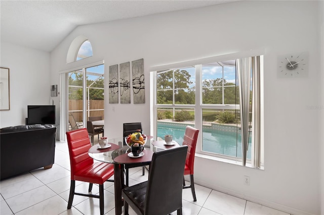 2979 Viscount Cir, Kissimmee, FL 34747 - dining room featuring vaulted ceiling and light tile patterned flooring