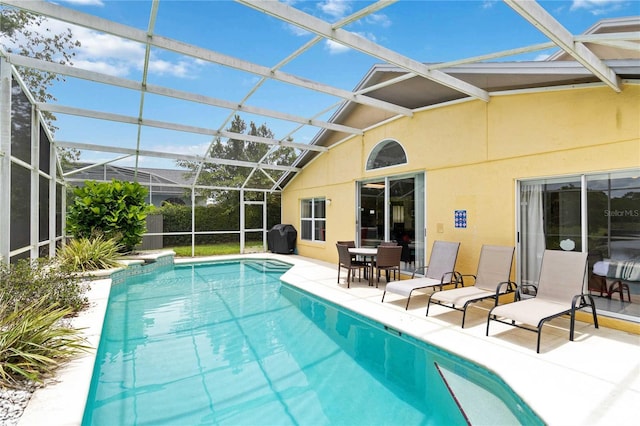 2979 Viscount Cir, Kissimmee, FL 34747 - swimming pool with a patio, glass enclosure, and a grill
