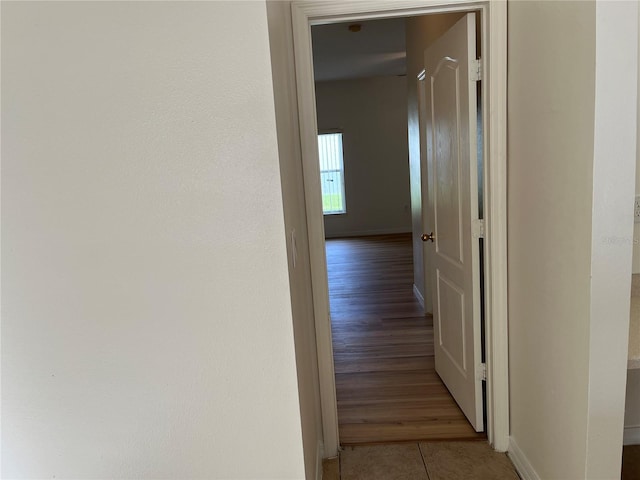 7714 Tanbier Dr, Orlando, FL 32818 - corridor with baseboards and light tile patterned flooring