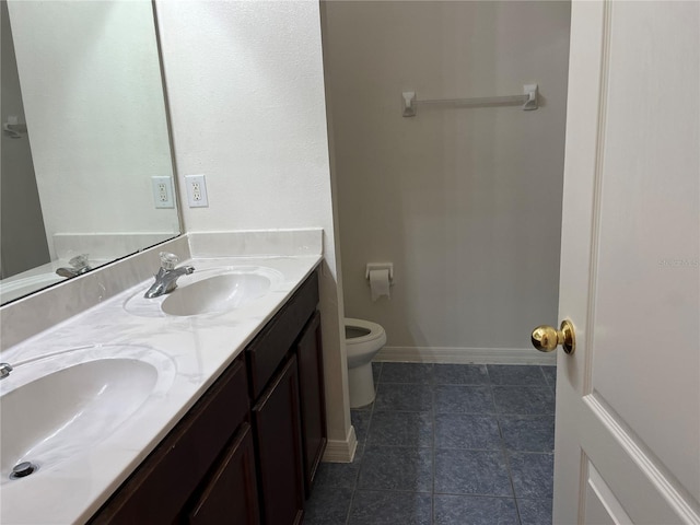 7714 Tanbier Dr, Orlando, FL 32818 - full bathroom featuring double vanity and tile patterned flooring