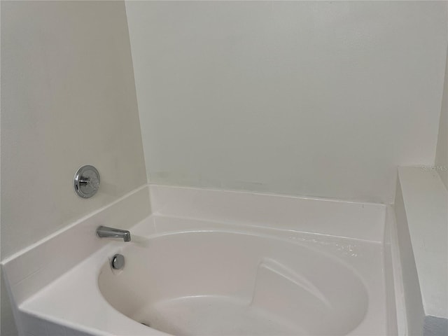 7714 Tanbier Dr, Orlando, FL 32818 - bathroom with a garden tub