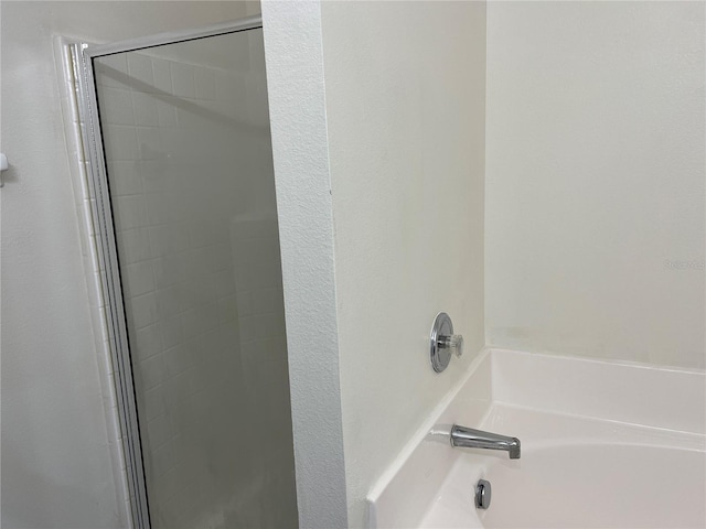 7714 Tanbier Dr, Orlando, FL 32818 - bathroom with a shower with shower door and a garden tub