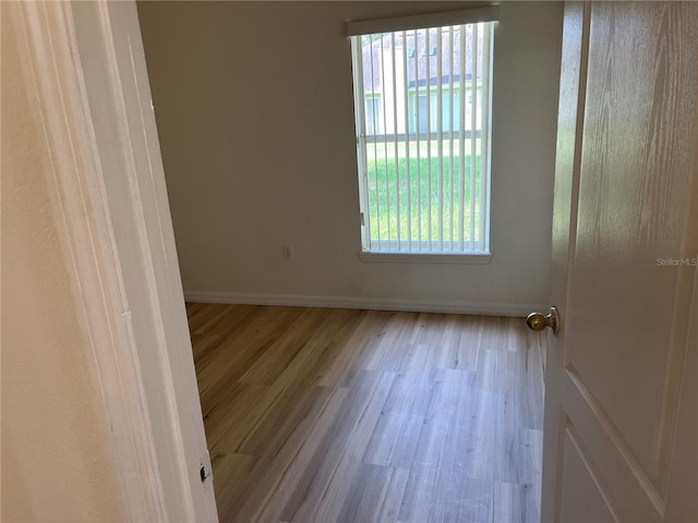 7714 Tanbier Dr, Orlando, FL 32818 - empty room with plenty of natural light and wood finished floors